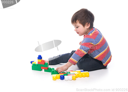 Image of Boy with multicolored bricks