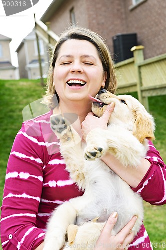 Image of Woman holding puppy
