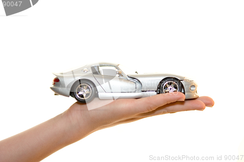 Image of Car toy on palm