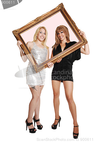 Image of Two girls with picture frame.