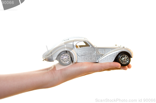 Image of Car toy on palm