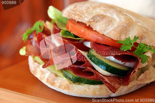 Image of Appetizing sandwich with ham and vegetables