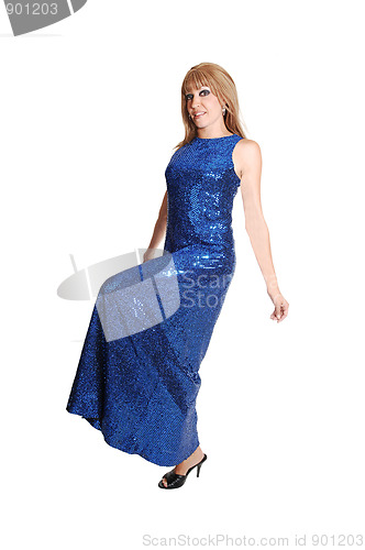 Image of Girl in long dress standing.
