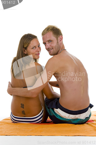 Image of couple on a beach towel