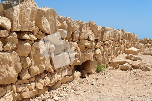 Image of Broken wall of ancient fortress ruin converging in perspective