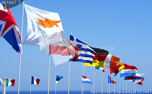 Image of Flags of the EU against blue sky