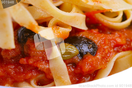 Image of Pasta alla puttanesca with black olives, capers, anchovies and c