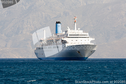 Image of Tourist cruise sea liner is sailing in rocky bay