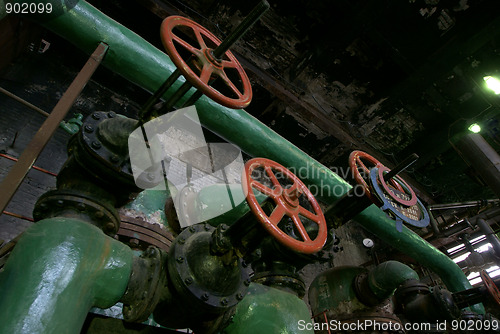 Image of Pipes, tubes, machinery and steam turbine at a power plant      