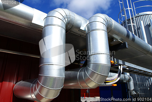 Image of Industrial zone, Steel pipelines on blue sky 