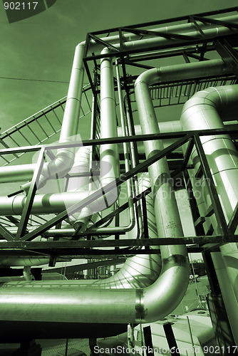 Image of Industrial zone, Steel pipelines in green tones    