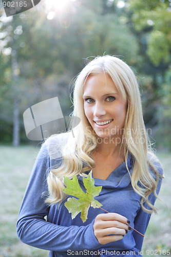 Image of Beautiful autumn woman