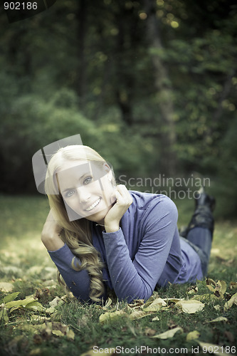 Image of Happy beautiful autumn woman