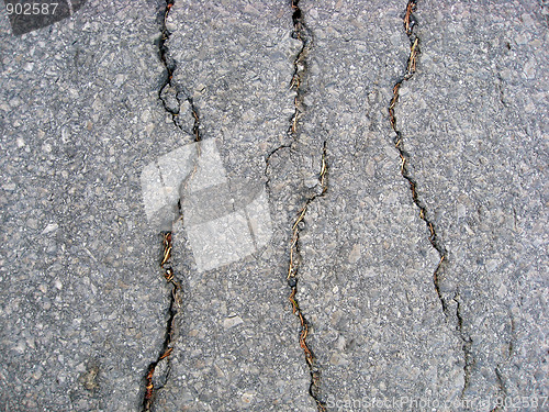 Image of Cracks on asphalt background 