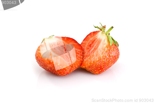 Image of Tasty ripe red strawberry sliced on half