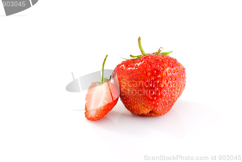 Image of One whole and one half of tasty ripe red strawberry