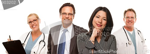 Image of Hispanic Woman with Husband and Male Doctors or Nurses