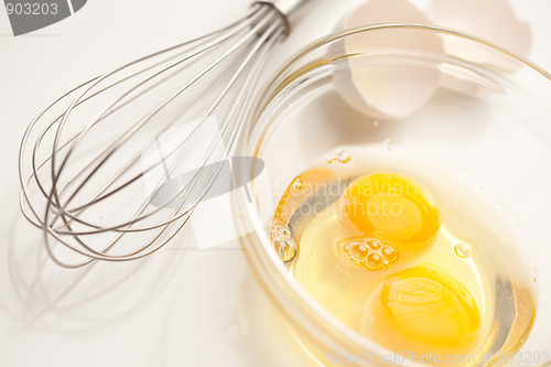 Image of Hand Mixer with Eggs in Glass Bowl