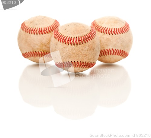 Image of Three Baseballs Isolated on Reflective White