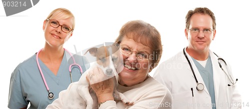 Image of Happy Senior Woman with Dog and Veterinarian Team