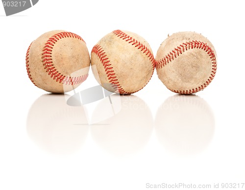 Image of Three Baseballs Isolated on Reflective White