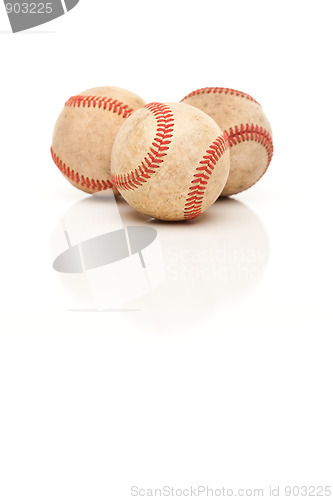 Image of Three Baseballs Isolated on Reflective White