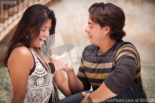 Image of Hispanic Man Proposing to His Love