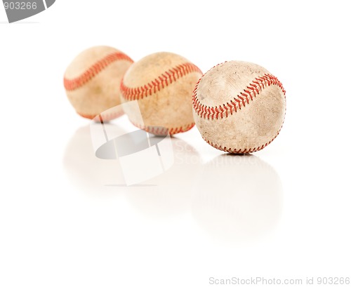 Image of Three Baseballs Isolated on Reflective White