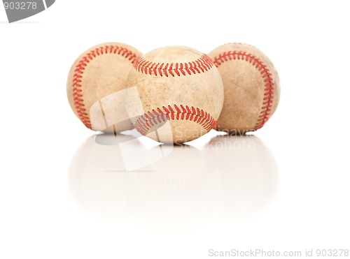 Image of Three Baseballs Isolated on Reflective White