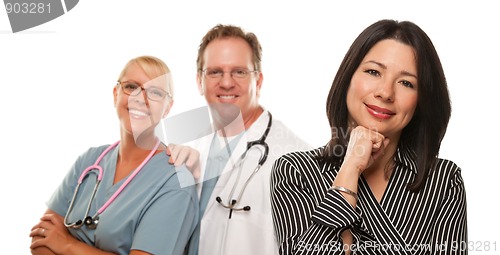Image of Hispanic Woman with Male Doctor and Nurse