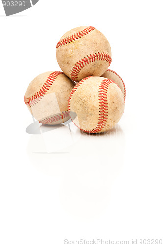 Image of Four Baseballs Isolated on Reflective White