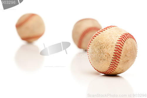 Image of Three Baseballs Isolated on Reflective White
