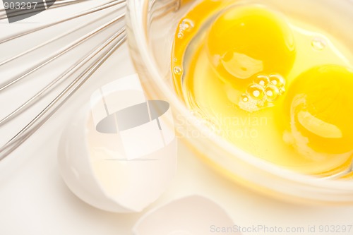 Image of Hand Mixer with Eggs in Glass Bowl