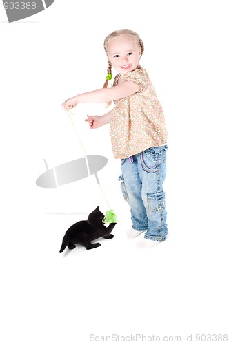 Image of Little girl playing with kitten