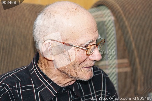 Image of Senior on sofa sideview