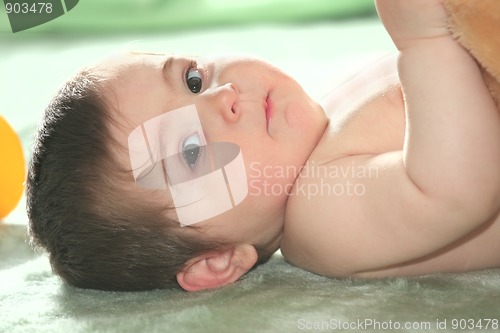 Image of Baby laying down on floor
