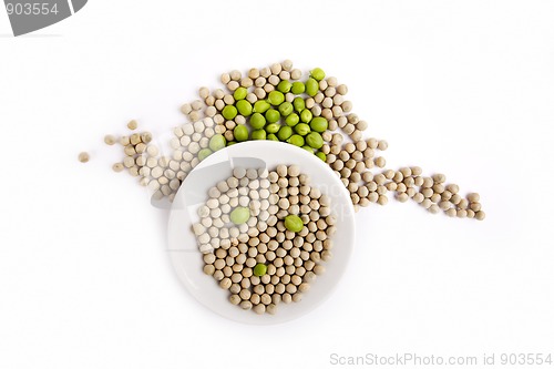 Image of Fresh and dried green peas on plate