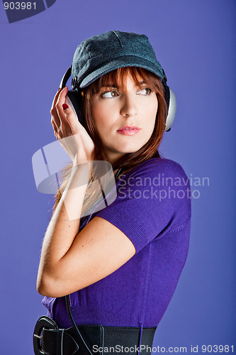 Image of Beautiful woman listening music