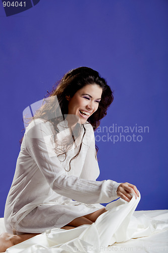 Image of Beautiful woman on the bed