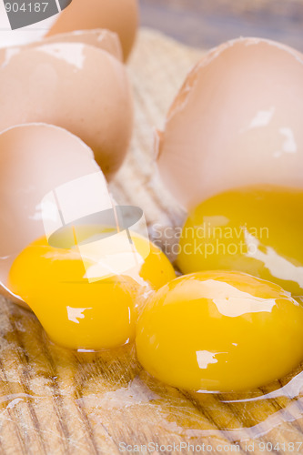 Image of broken brown eggs