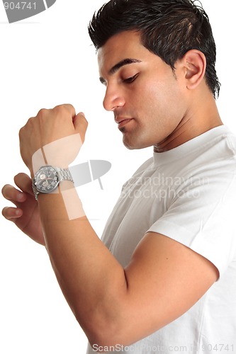 Image of Man putting on chronograph watch