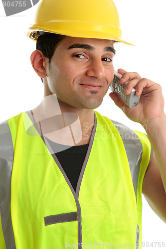 Image of Builder  tradesman on telephone