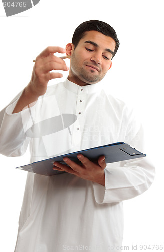 Image of Middle eastern business man writing