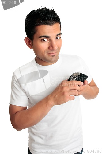 Image of Smiling man showing a watch