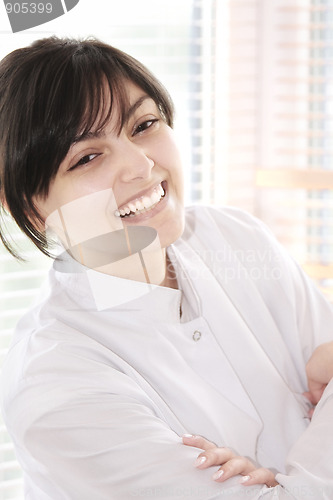 Image of Smiling brunette in smock