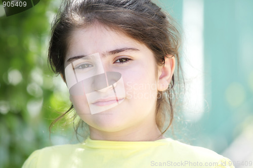 Image of Brunette girl in yellow shirt