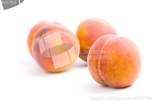 Image of four peaches