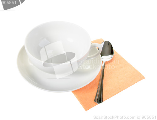 Image of White empty mug and spoon on orange paper napkin