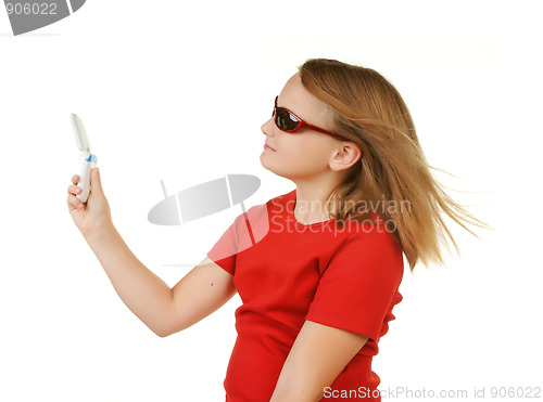 Image of young girl taking phone with phone