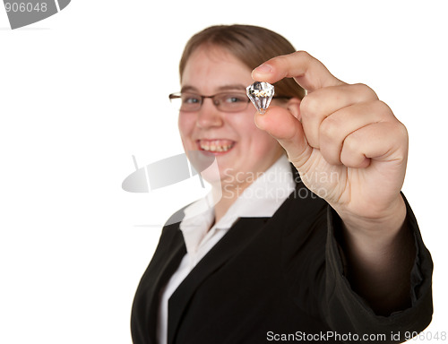 Image of successful young business woman holding diamond